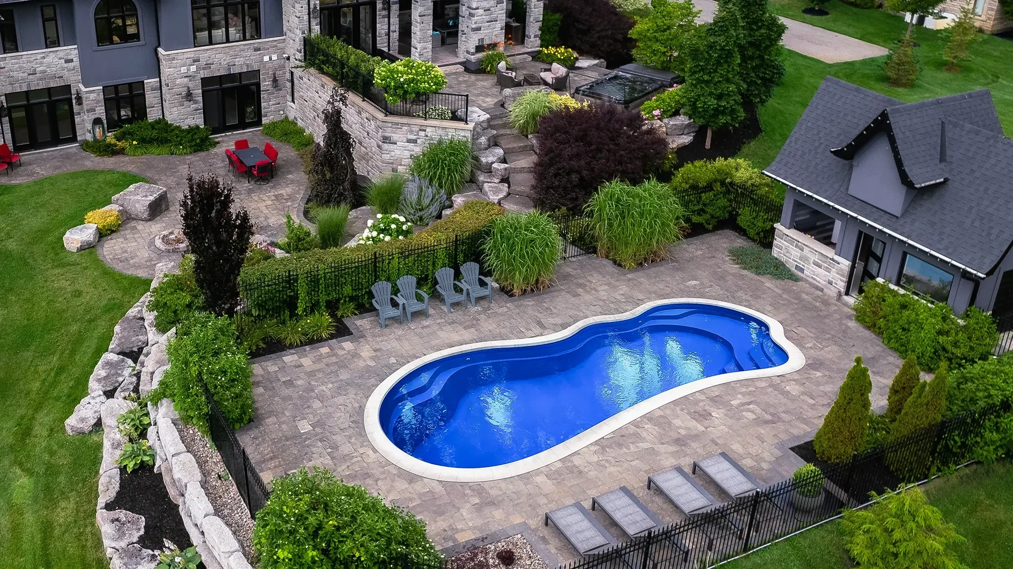 Curved pool in a landscaped garden
